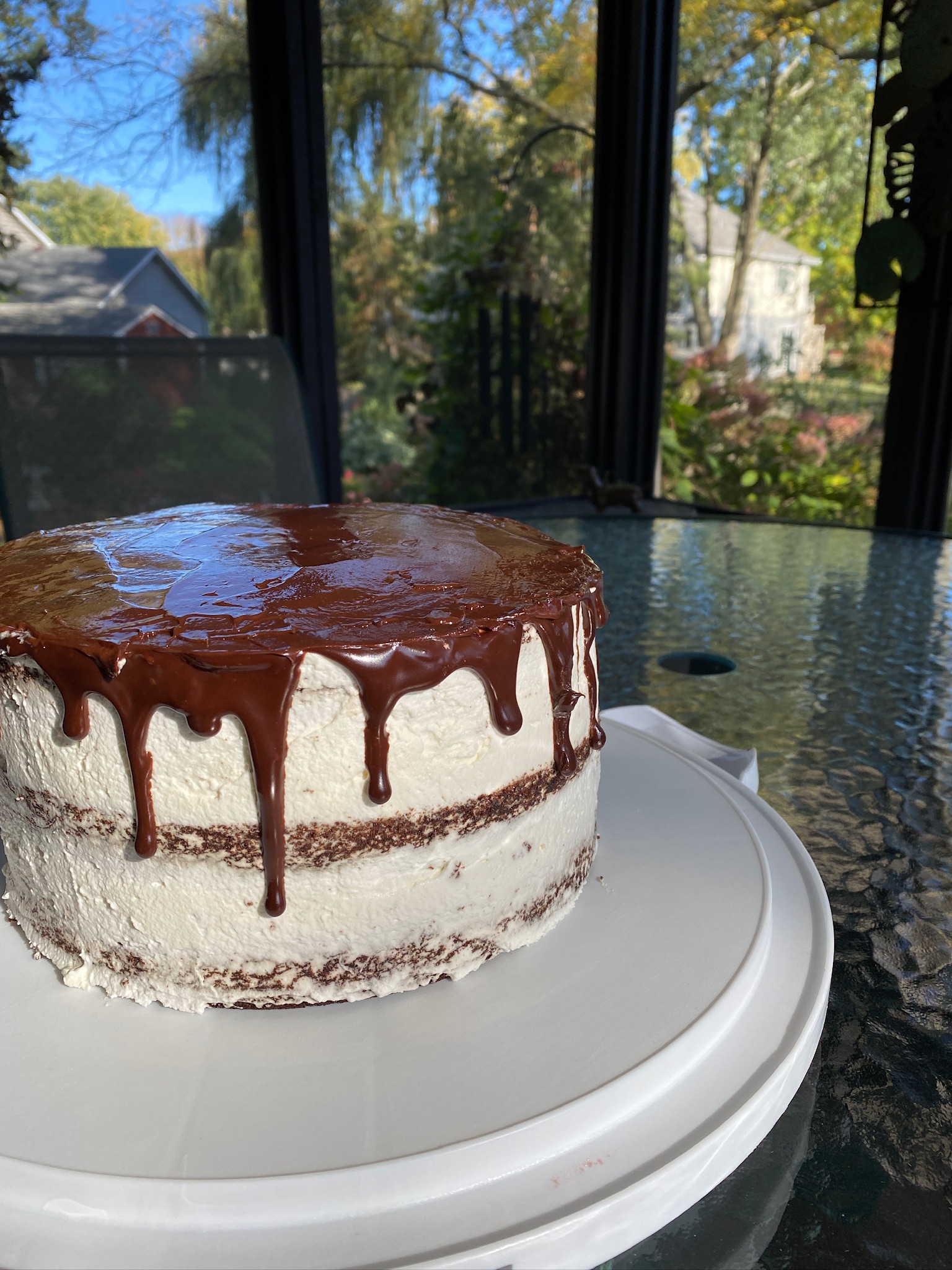 A 6 inch cake with chocolate ganache frosting.
