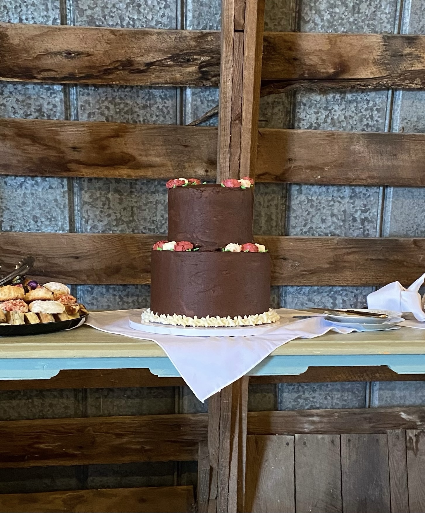 A decorated chocolate wedding cake.